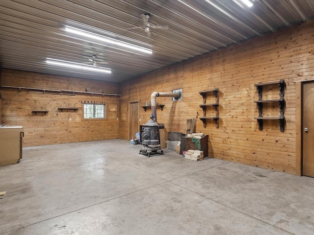 4228 County Hwy W, Valders, WI 54245 - garage featuring a wood stove and wood walls