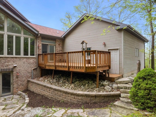 4228 County Hwy W, Valders, WI 54245 - back of house featuring a deck and brick siding