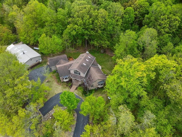 4228 County Hwy W, Valders, WI 54245 - aerial view of property and surrounding area with a heavily wooded area