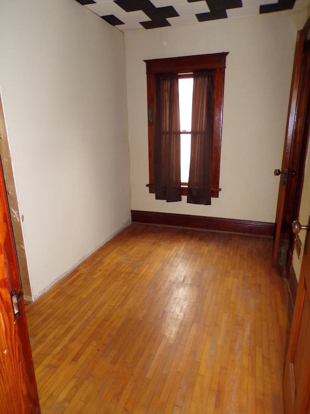 208 S Walker St, Wautoma, WI 54982 - spare room featuring light wood-style floors and baseboards