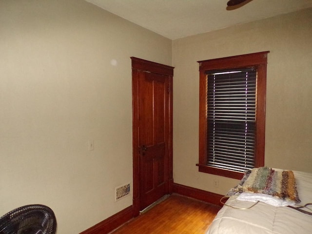 208 S Walker St, Wautoma, WI 54982 - bedroom featuring wood finished floors and baseboards