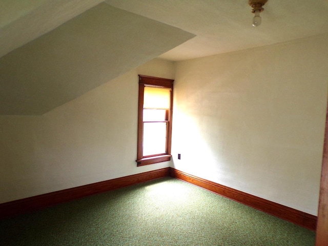208 S Walker St, Wautoma, WI 54982 - bonus room featuring baseboards and vaulted ceiling