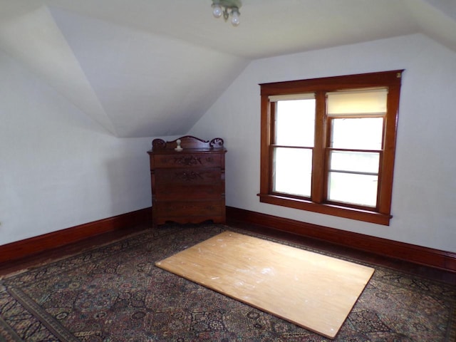 208 S Walker St, Wautoma, WI 54982 - additional living space with vaulted ceiling and baseboards