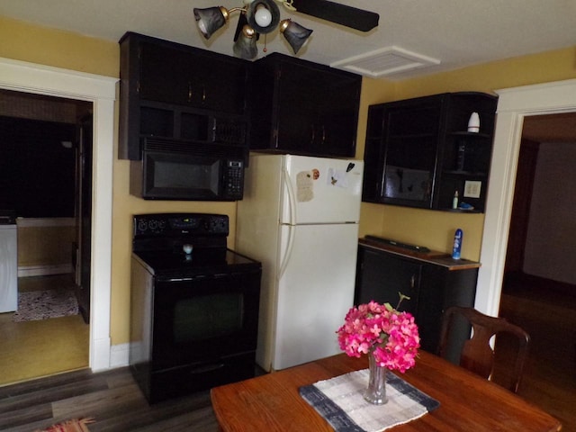 208 S Walker St, Wautoma, WI 54982 - kitchen featuring black appliances, dark cabinetry, wood finished floors, and a ceiling fan