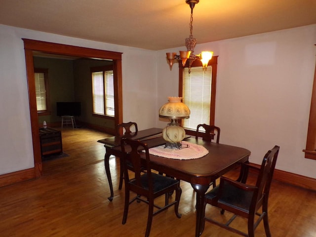 208 S Walker St, Wautoma, WI 54982 - dining area with a chandelier and wood finished floors