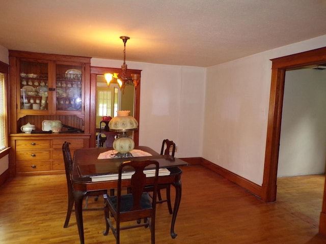 208 S Walker St, Wautoma, WI 54982 - dining room with light wood finished floors and a chandelier