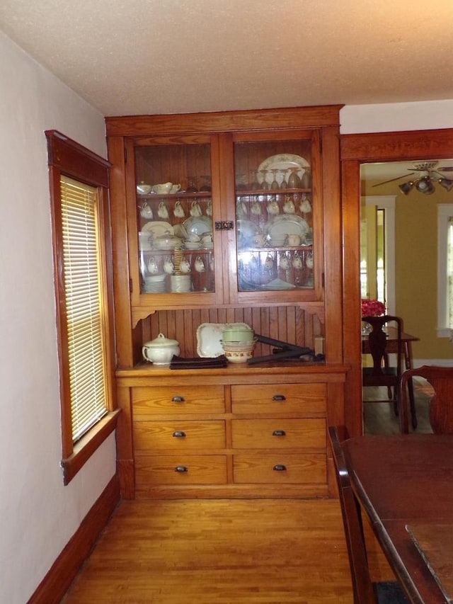 208 S Walker St, Wautoma, WI 54982 - dining space featuring light wood-style floors and a textured ceiling