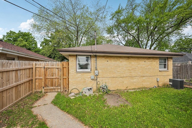 3838 N 78th St, Milwaukee, WI 53222 - view of side of property with brick siding, a gate, and a shingled roof