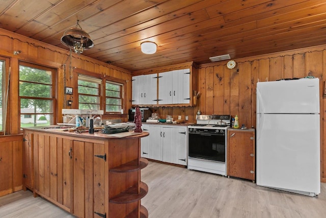 8950 Pine Ln, Fremont, WI 54940 - kitchen featuring freestanding refrigerator, range, wood ceiling, wooden walls, and light wood finished floors