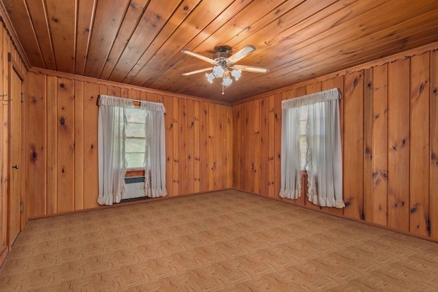 8950 Pine Ln, Fremont, WI 54940 - spare room featuring wood ceiling, wood walls, and a ceiling fan