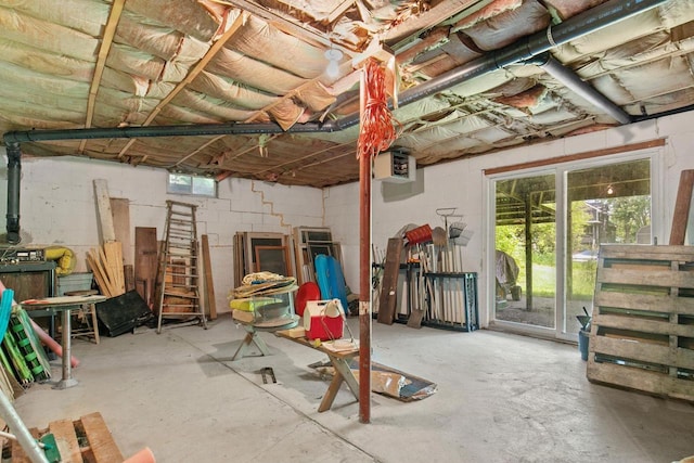 8950 Pine Ln, Fremont, WI 54940 - below grade area featuring concrete block wall and a heating unit