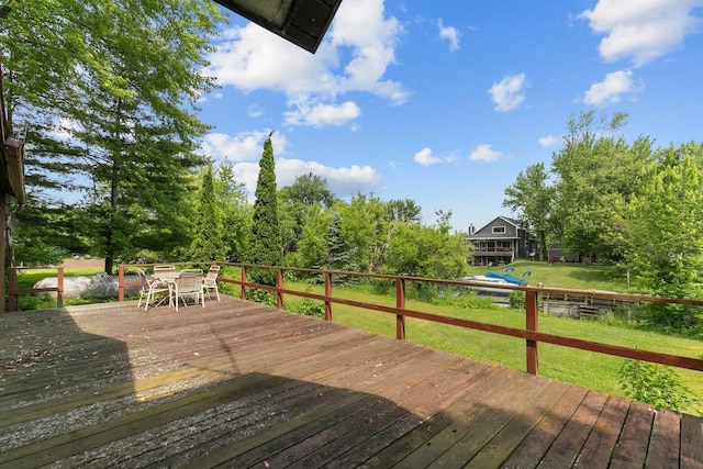 8950 Pine Ln, Fremont, WI 54940 - deck with outdoor dining space and a lawn