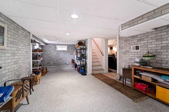600 Forest Ave, Fond Du Lac, WI 54935 - basement with carpet, stairs, a paneled ceiling, and brick wall