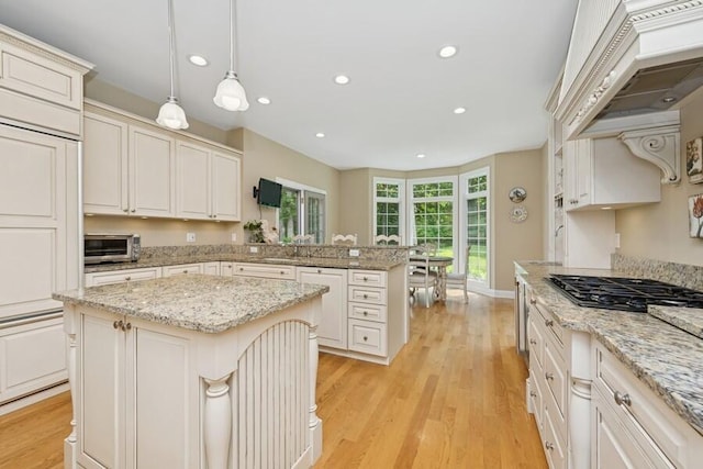N1760 W Valley Park Rd, Lake Geneva, WI 53147 - kitchen featuring black gas stovetop, recessed lighting, a peninsula, light wood-style floors, and a kitchen island