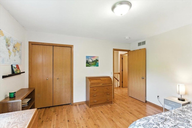 26 Maple Valley Ct, Madison, WI 53719 - bedroom with light wood-type flooring and a closet
