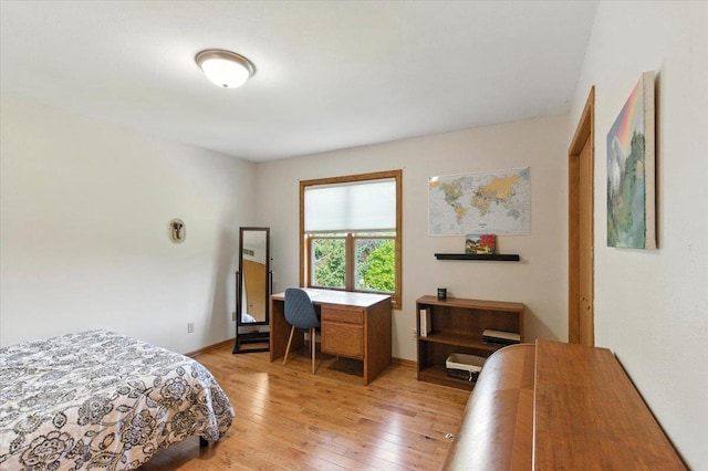 26 Maple Valley Ct, Madison, WI 53719 - bedroom with light wood-style floors and an office area