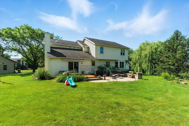 26 Maple Valley Ct, Madison, WI 53719 - rear view of house featuring a patio area, a chimney, an outdoor fire pit, and a yard