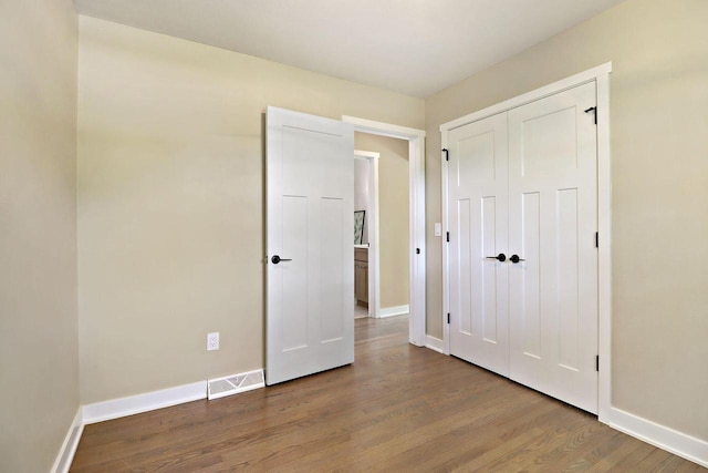 2336 128th St, Pleasant Prairie, WI 53158 - unfurnished bedroom with wood finished floors and a closet