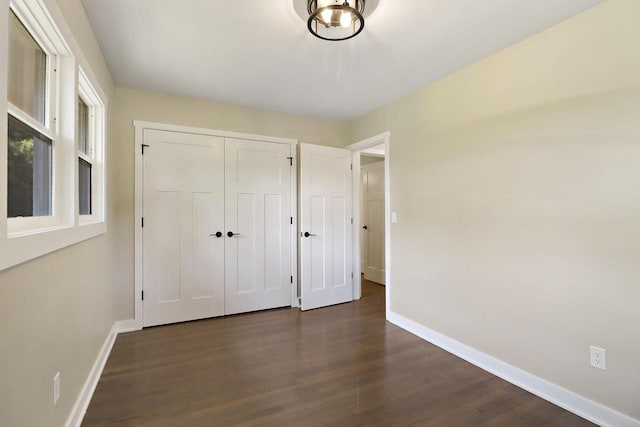 2336 128th St, Pleasant Prairie, WI 53158 - unfurnished bedroom with dark wood-type flooring and a closet