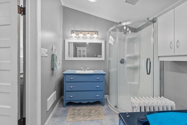 628 Broad St, Menasha, WI 54952 - full bathroom featuring radiator, vanity, a stall shower, tile patterned floors, and vaulted ceiling