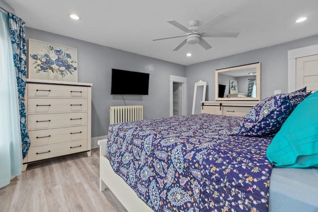 628 Broad St, Menasha, WI 54952 - bedroom featuring radiator, wood finished floors, recessed lighting, and a ceiling fan