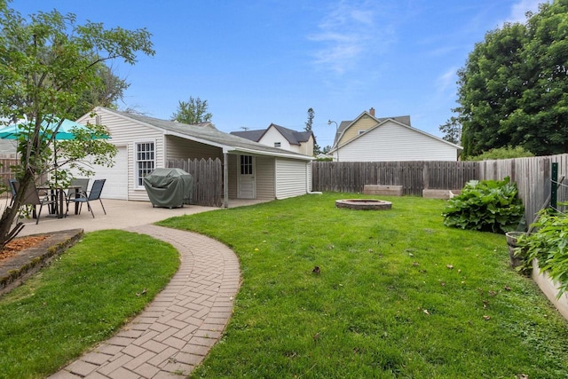 628 Broad St, Menasha, WI 54952 - fenced backyard with a fire pit and a patio area