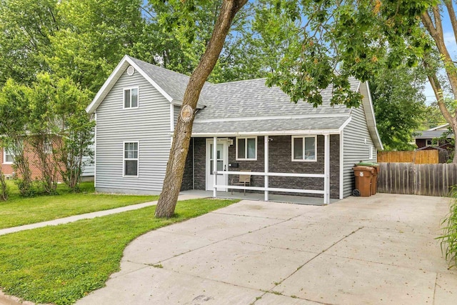448 Wadleigh St, Stevens Point, WI 54481 - traditional home with a shingled roof and driveway