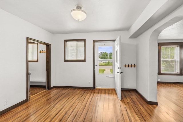 448 Wadleigh St, Stevens Point, WI 54481 - foyer entrance featuring arched walkways, healthy amount of natural light, and hardwood / wood-style floors