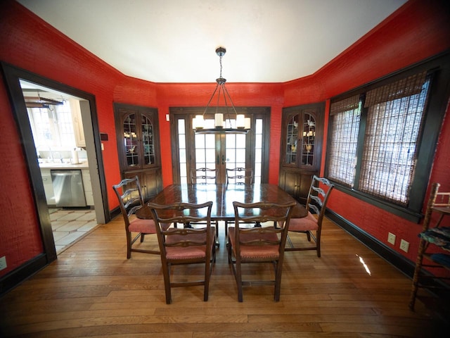 2544 N 91st St, Wauwatosa, WI 53226 - dining room featuring wood-type flooring, healthy amount of natural light, and a chandelier
