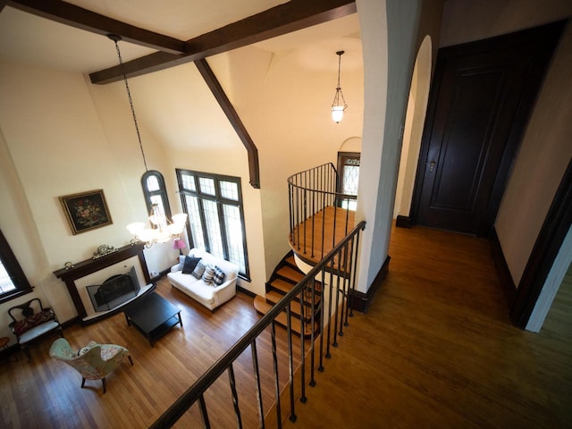 2544 N 91st St, Wauwatosa, WI 53226 - stairs featuring arched walkways, plenty of natural light, beamed ceiling, wood finished floors, and high vaulted ceiling
