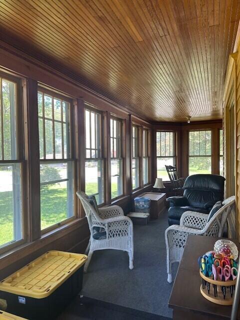 300 Pine St, Weyauwega, WI 54983 - sunroom with healthy amount of natural light, wood ceiling, and carpet flooring