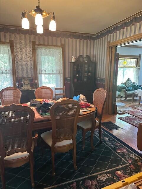 300 Pine St, Weyauwega, WI 54983 - dining room featuring wallpapered walls and a chandelier