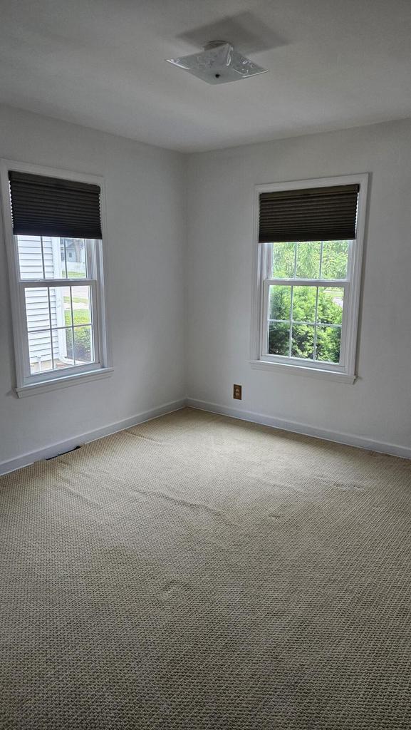 1518 Lathrop Ave, Racine, WI 53405 - unfurnished room featuring plenty of natural light and carpet flooring