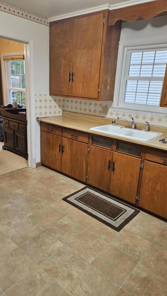 1518 Lathrop Ave, Racine, WI 53405 - kitchen featuring tasteful backsplash, plenty of natural light, and light countertops