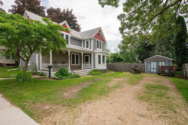 158 S State St, Berlin, WI 54923 - victorian home featuring a porch and a storage shed