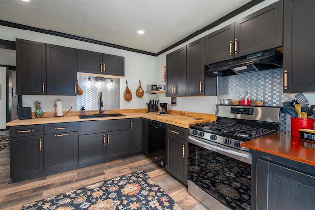 158 S State St, Berlin, WI 54923 - kitchen with under cabinet range hood, stainless steel gas stove, black dishwasher, light wood-style floors, and decorative backsplash