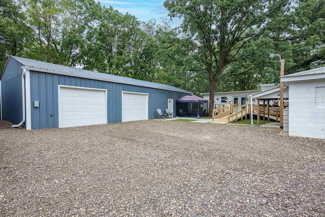 1207 S Main St, Necedah, WI 54646 - detached garage featuring view of scattered trees