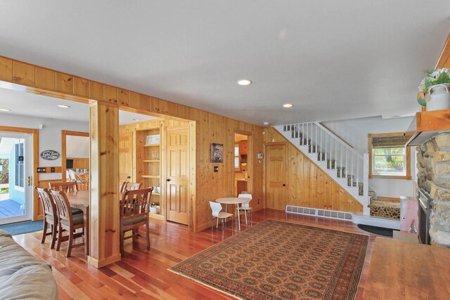 W5374 Westshore Dr, Elkhorn, WI 53121 - living room with stairway, wooden walls, wood finished floors, and recessed lighting