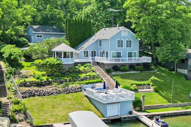 W5374 Westshore Dr, Elkhorn, WI 53121 - back of house featuring stairs, a gazebo, a deck with water view, and a lawn