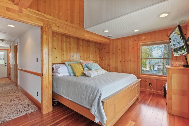 W5374 Westshore Dr, Elkhorn, WI 53121 - bedroom featuring multiple windows, wood-type flooring, wood walls, and recessed lighting