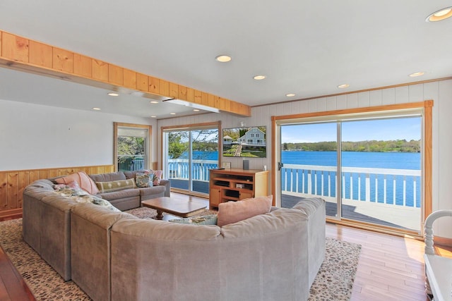 W5374 Westshore Dr, Elkhorn, WI 53121 - living area with wood finished floors, recessed lighting, plenty of natural light, wood walls, and a water view