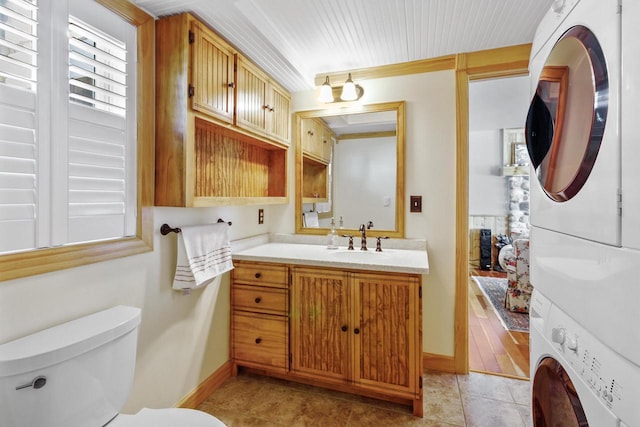 W5374 Westshore Dr, Elkhorn, WI 53121 - bathroom with stacked washer / dryer, vanity, and tile patterned flooring
