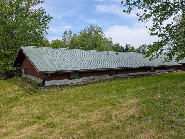 774 Enloe Rd, Rewey, WI 53580 - view of side of property with a lawn and a metal roof