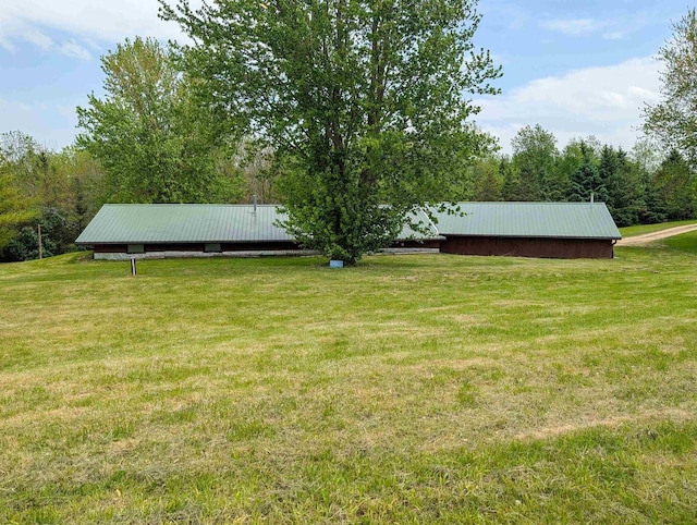 774 Enloe Rd, Rewey, WI 53580 - view of grassy yard featuring a pole building and an outdoor structure