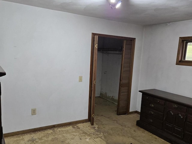 774 Enloe Rd, Rewey, WI 53580 - unfurnished bedroom with unfinished concrete floors and a closet