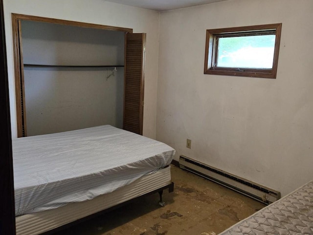 774 Enloe Rd, Rewey, WI 53580 - bedroom featuring baseboard heating, a closet, and unfinished concrete floors