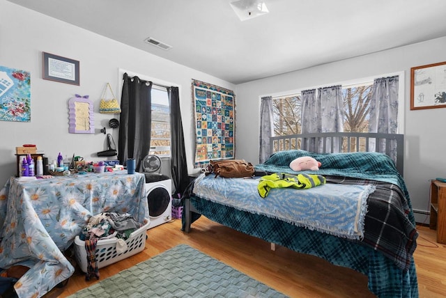 1-3 Mechanic St, Edgerton, WI 53534 - bedroom with wood finished floors and baseboard heating