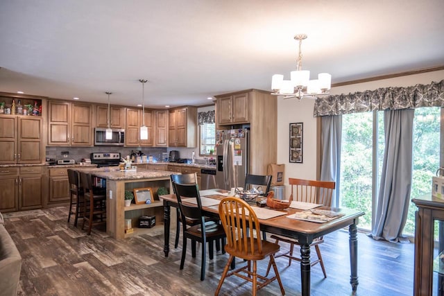 W5671 8th St, Necedah, WI 54646 - dining room featuring a chandelier, dark wood-style floors, and recessed lighting
