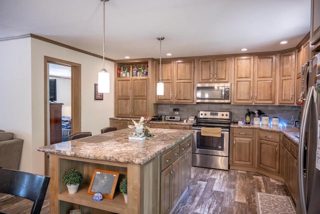 W5671 8th St, Necedah, WI 54646 - kitchen with stainless steel appliances, open shelves, dark wood finished floors, decorative backsplash, and a kitchen island