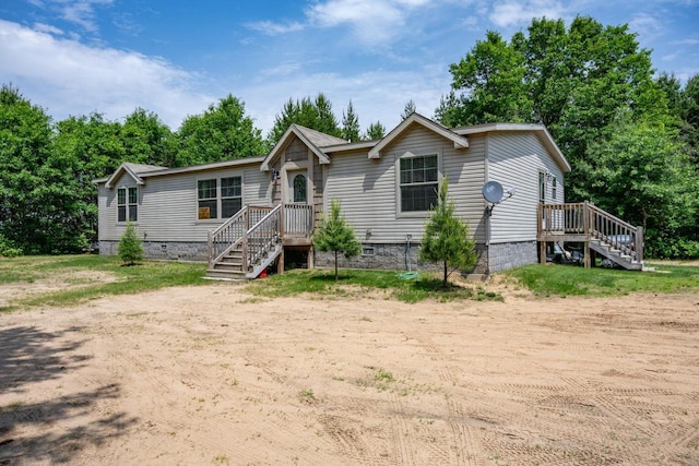 W5671 8th St, Necedah, WI 54646 - manufactured / mobile home with crawl space and stairs